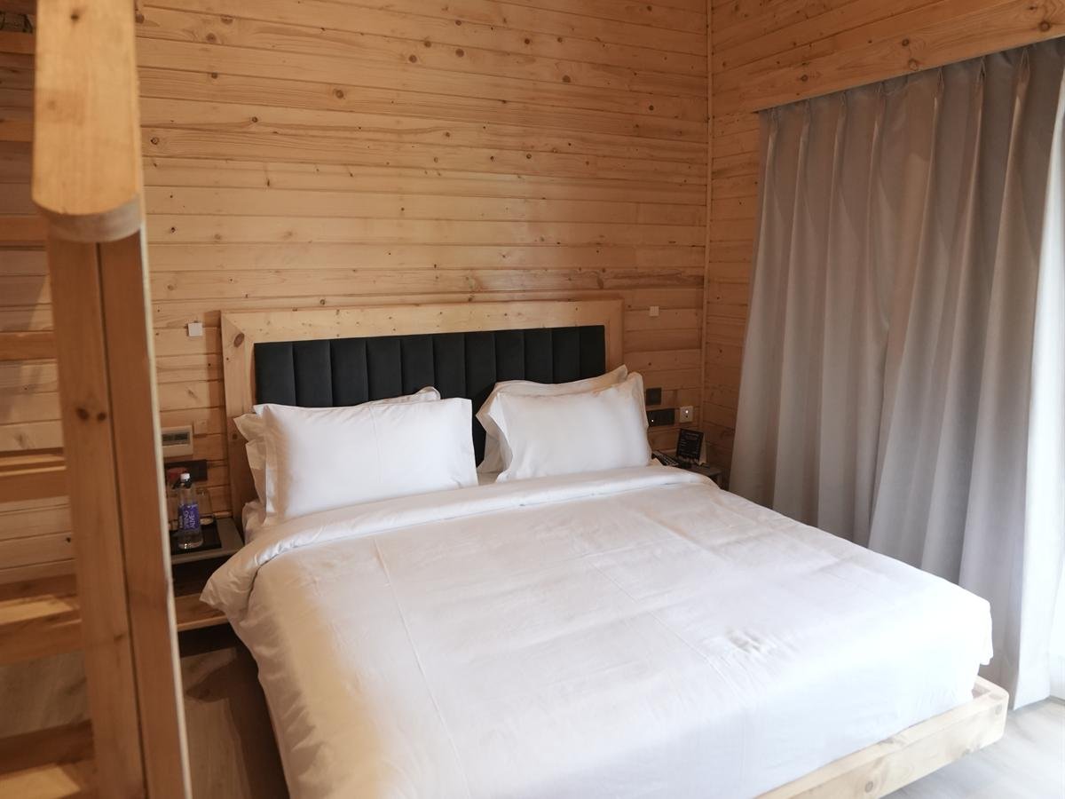 Deluxe Cottage bedroom with blackout curtains