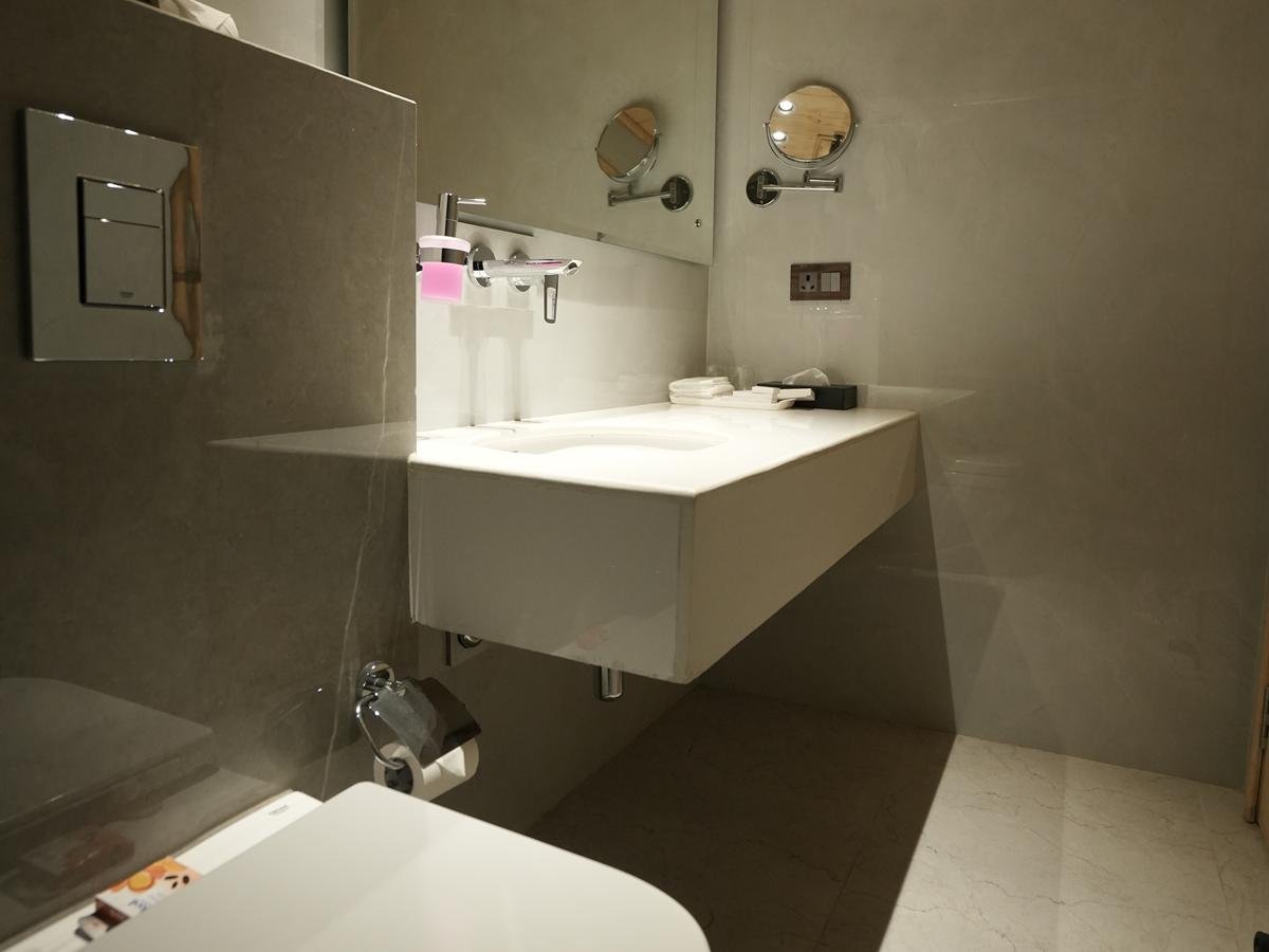 Standard Cottage bathroom with floating stone vanity